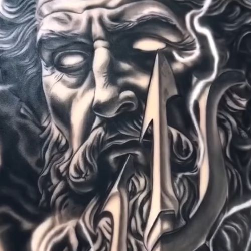 A bearded god's face behind a trident and forked lightning, tattooed in high-contrast black and grey on a TrueSkin sheet.